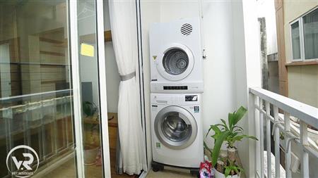 Washer and dryer in balcony near livingroom